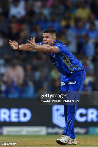 Mumbai Indians' Arjun Tendulkar successfully appeals against Punjab Kings' Prabhsimran Singh during the Indian Premier League Twenty20 cricket match...