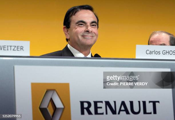 The head of the French and Japanese automakers Renault and Nissan, Carlos Ghosn, smiles as he delivers a speech during a general assembly of Renault,...