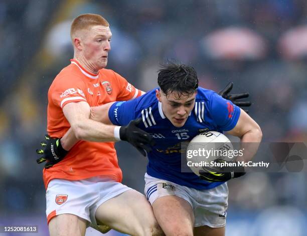 Cavan , Ireland - 22 April 2023; Oisin Brady of Cavan in action against Ciaran Mackin of Armagh during the Ulster GAA Football Senior Championship...