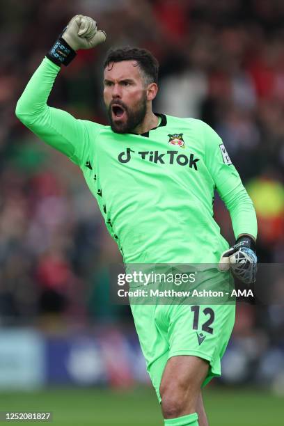 Ben Foster of Wrexham celebrates after his team score to make it 1-1 during the Vanarama National League match between Wrexham and Boreham Wood at...