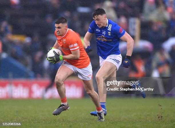 Cavan , Ireland - 22 April 2023; Greg McCabe of Armagh in action against Conor Brady of Cavan during the Ulster GAA Football Senior Championship...