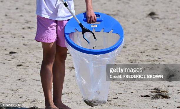 Trash is picked up at Venice Beach on Earth Day on April 22 in Los Angeles, California. Beach and river cleanups are being held across Southern...