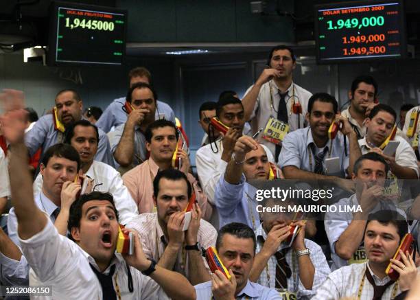 Brazil's stock traders negotiate at the future dollar pit prior to the morning closing time, at the Mercantile & Futures Exchange , in Sao Paulo,...