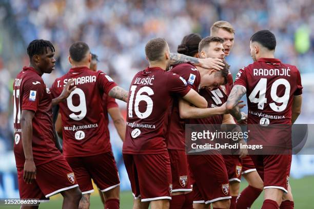 Ivan Ilic of Torino FC celebrates after scoring his team's first goal with team mates during the Serie A match between SS Lazio and Torino FC at...