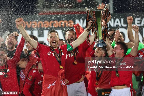 Ben Tozer and Luke Young of Wrexham lift the Vanarama National League Trophy as Wrexham celebrate promotion back to the English Football League...