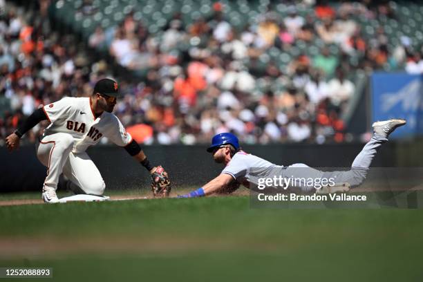 Jeff McNeil of the New York Mets is tagged out at third by David Villar of the San Francisco Giants in the fourth inning of the game at Oracle Park...