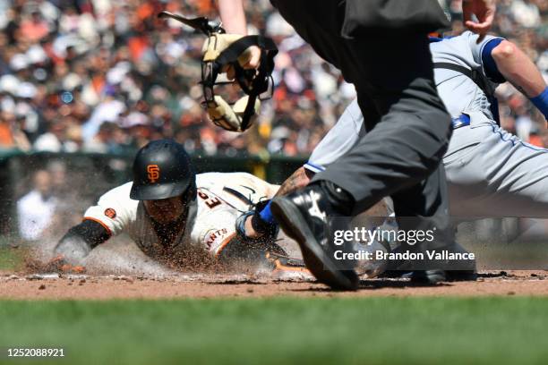 Thairo Estrada of the San Francisco Giants scores in the third inning of the game against the New York Mets at Oracle Park on April 22, 2023 in San...