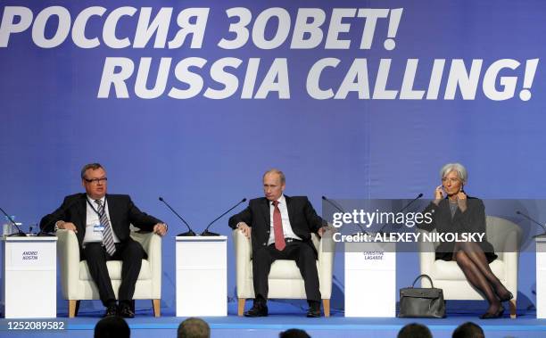 Russia's Prime Minister Vladimir Putin , VTB Bank Chief Executive Andrei Kostin and France's Finance Minister Christine Lagarde take part in the...