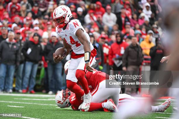 Quarterback Jeff Sims of Nebraska Cornhuskers breaks two tackles to score at Memorial Stadium on April 22, 2023 in Lincoln, Nebraska.