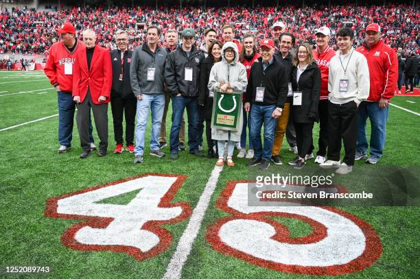 Former head coach Frank Solich of the Nebraska Cornhuskers and his wife Pamela Solich are honored at halftime surrounded by family and administrators...