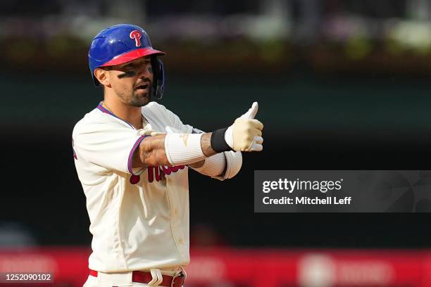 Nick Castellanos of the Philadelphia Phillies reacts after hitting a double in the bottom of the eighth inning against the Colorado Rockies at...