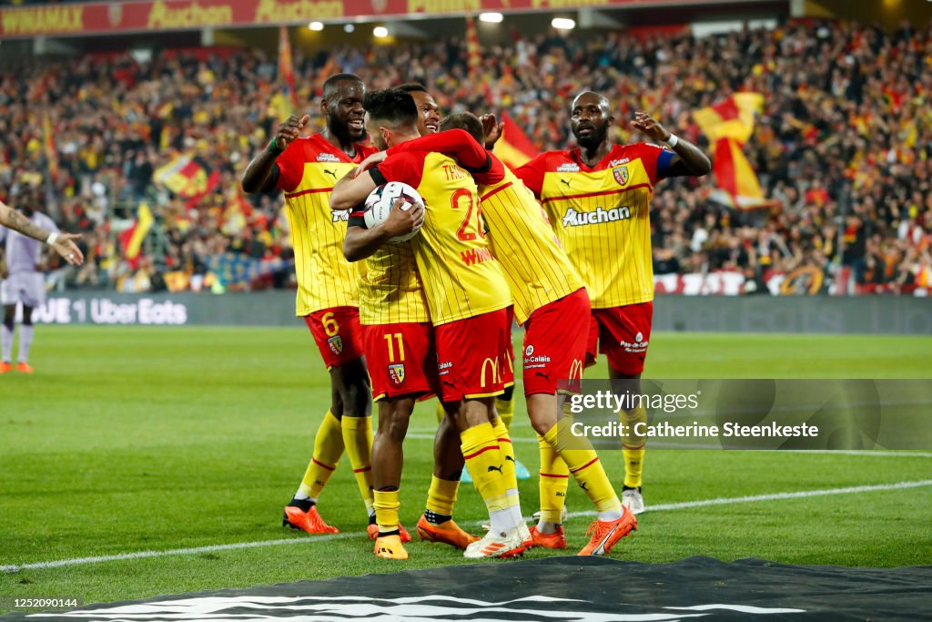Adrien Thomasson Of RC Lens Celebrates His Goal With His Teammates adrien-thomasson-of-rc-lens-celebrates-his-goal-with-his-teammates