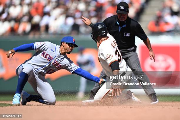 David Villar of the San Francisco Giants is tagged out at second base by Francisco Lindor of the New York Mets during the game at Oracle Park on...