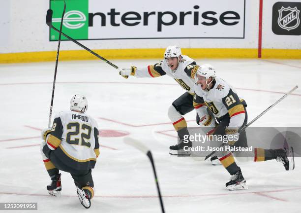Brett Howden, Ivan Barbashev and Michael Amadio of the Vegas Golden Knights celebrate defeating the Winnipeg Jets in the second overtime period of...