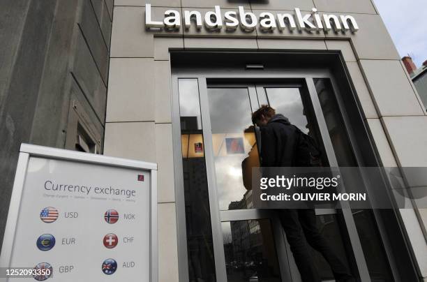 Man enters a branch of Iceland's second largest bank, Landsbanki on October 8, 2008 in Rejkjavik, a day after the Icelandic state officially...