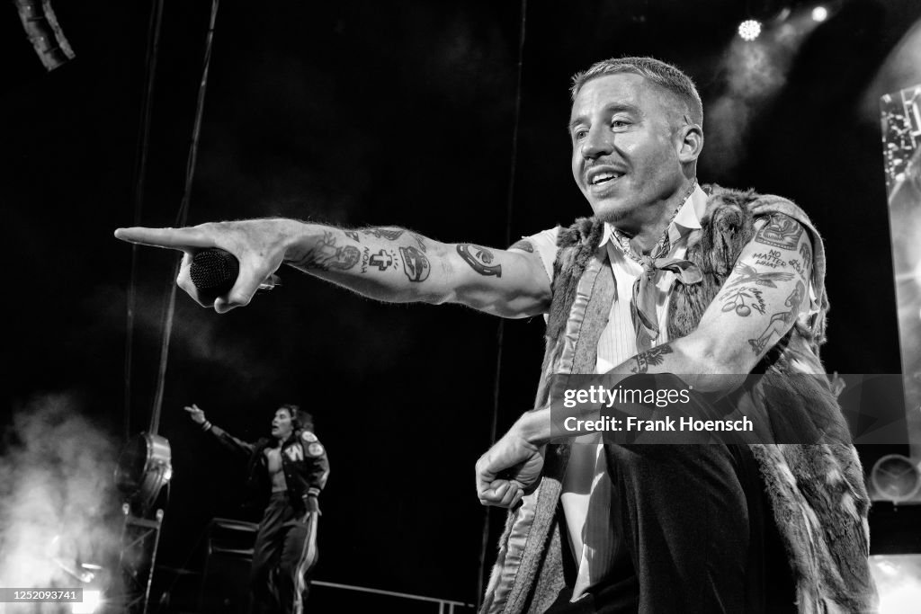 Macklemore Rapping American rapper Macklemore performs live on stage during a concert at ...