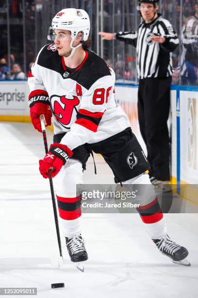 Jack Hughes of the New Jersey Devils skates with the puck against the New York Rangers in Game Three of the First Round of the 2023 Stanley Cup...