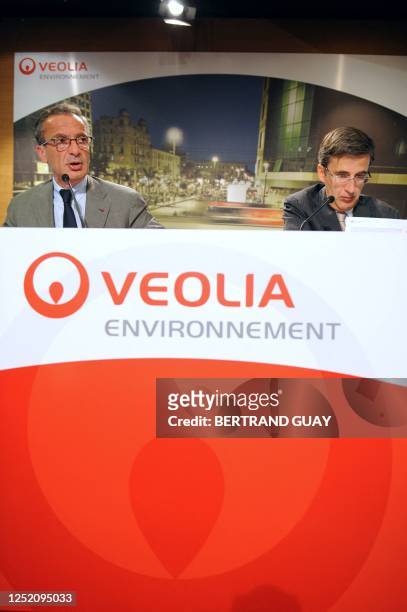 Chairman and Chief Executive Officer of Veolia Environnement, Henri Proglio , flanked by Senior Executive Vice President, Jerome Contamine talks to...