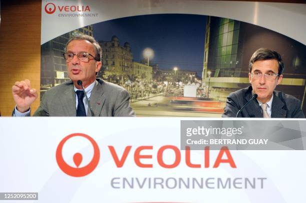 Chairman and Chief Executive Officer of Veolia Environnement, Henri Proglio , flanked by Senior Executive Vice President, Jerome Contamine, adresses...