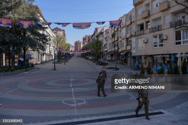 Members of NATO peacekeeping mission in Kosovo patrol in the north of Mitrovica, predominantly populated by the ethnic Serb minority amid the...