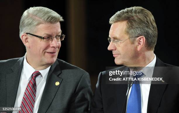 Members of the Arraiolos Group, German President Christian Wulff and Latvia's President Valdis Zatlers speak prior to their closing press conference...