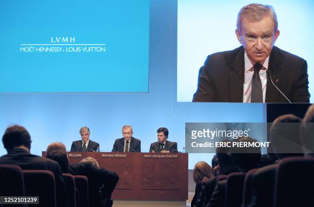 Global Luxury retailer LVMH Chairman Bernard Arnault flanked by group managing director Antonio Belloni and CFO Jean-Jacques Guiony answers to...