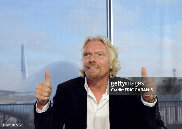 Of Virgin Group, Sir Richard Branson gestures as he gives a press conference, on January 17, 2011 in Colomiers, western France, to announce that...