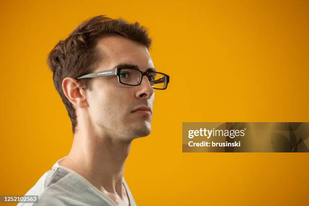 studio portrait of a young man - three quarter front view stock pictures, royalty-free photos & images