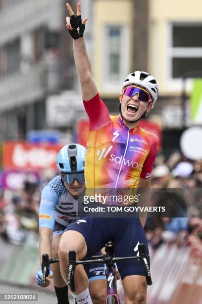 Worx's Dutch rider Demi Vollering celebrates crossing the finish line and winning the women elite race of the Liege-Bastogne-Liege one day cycling...