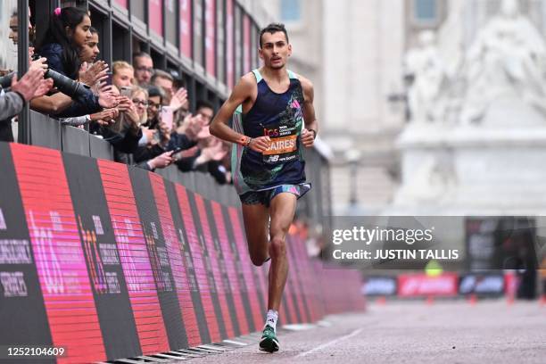 Britain's Emile Cairess runs to the line as he finishes the men's race in 6th place at the 2023 London Marathon in central London on April 23, 2023....