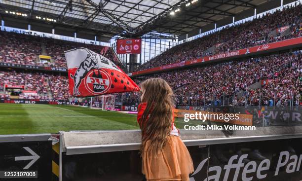 Fan waves a 1. FC Köln flag ahead of the FLYERALARM Frauen-Bundesliga match between 1. FC Koeln and Eintracht Frankfurt at RheinEnergie Stadion on...