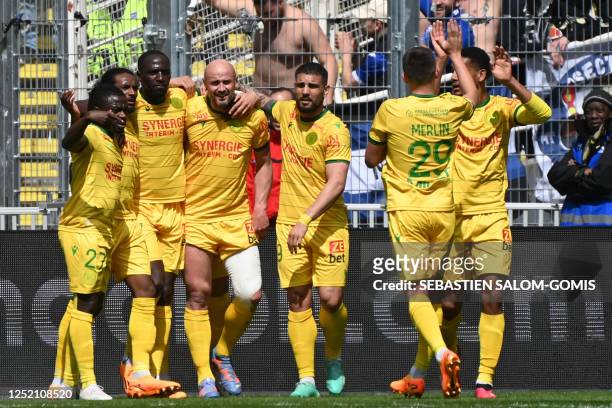 Nantes' players celebrate after scoring their first goal during the French L1 football match between FC Nantes and ES Troyes AC at the Stade de la...