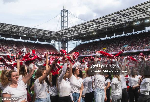 Fans celebrate at the halftime of the FLYERALARM Frauen-Bundesliga match between 1. FC Koeln and Eintracht Frankfurt at RheinEnergie Stadion on April...