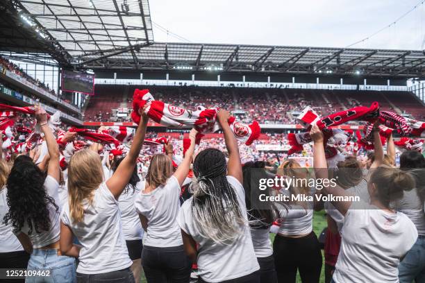 Fans celebrate at the halftime of the FLYERALARM Frauen-Bundesliga match between 1. FC Koeln and Eintracht Frankfurt at RheinEnergie Stadion on April...