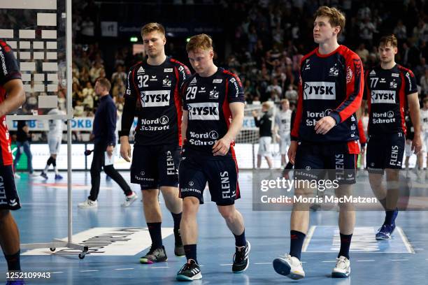 Flensburg players look dejected ass they leave after THW Kiel won the LIQUI MOLY HBL match between THW Kiel and SG Flensburg-Handewitt at Wunderino...