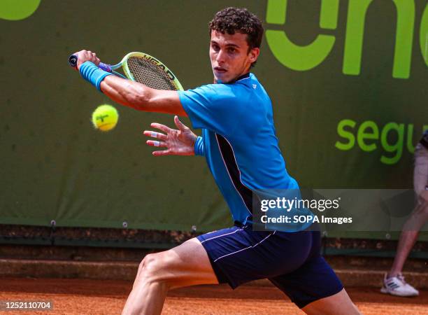 Juan Manuel Cerundolo of Argentina plays against Zsombor Piros of Hungary during the Final of the Oeiras Open tournament at Clube de Ténis do Jamor....