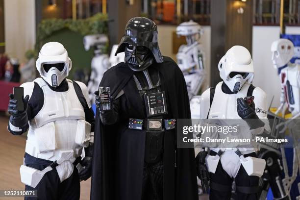 Cosplayer dressed as Darth Vader and cosplayers dressed as Stormtroopers with their mobile phones during a test of a new emergency public alert...