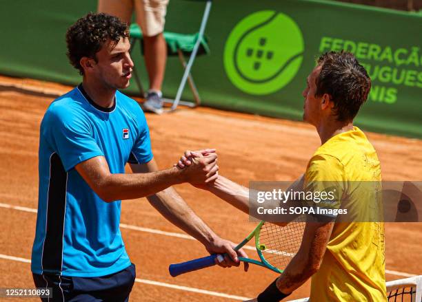 Zsombor Piros of Hungary and Juan Manuel Cerundolo of Argentina handshake during the Final of the Oeiras Open tournament at Clube de Ténis do Jamor....