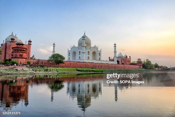 Sunset view at Taj Mahal from the back side of the Tomb. The Taj Mahal is a mausoleum located on the right bank of the river Yamuna - Agra, India,...