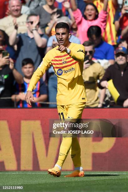 Barcelona's Spanish forward Ferran Torres celebrates scoring his team's first goal during the Spanish league football match between FC Barcelona and...