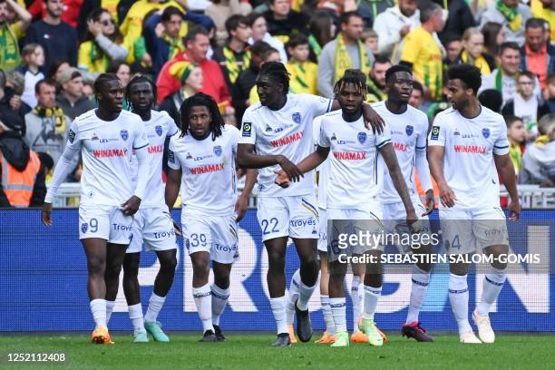 Troyes' players celebrate after scoring a goal during the French L1 football match between FC Nantes and ES Troyes AC at the Stade de la...