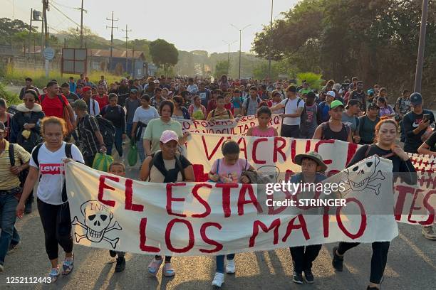 Migrants from Central and South America take part in a caravan attempting to reach the Mexico-US border, while carrying out a viacrucis to protest...