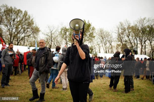 Member of the collective 'La Voie est Libre' makes an annoucement in the camp. The collectives 'La Voie Est Libre' , the farmers organization...