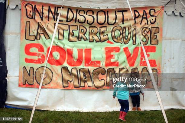 Banner in the camp reads 'One can't dissolve earth which rises up. No macadam'. The collectives 'La Voie Est Libre' , the farmers organization...