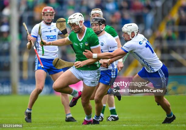 Tipperary , Ireland - 23 April 2023; Kyle Hayes of Limerick is tackled by Neil Montgomery of Waterford during the Munster GAA Hurling Senior...