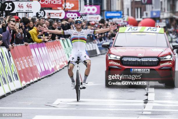 Belgian Remco Evenepoel of Soudal Quick-Step celebrates as he crosses the finish line to win the men elite race of the Liege-Bastogne-Liege one day...