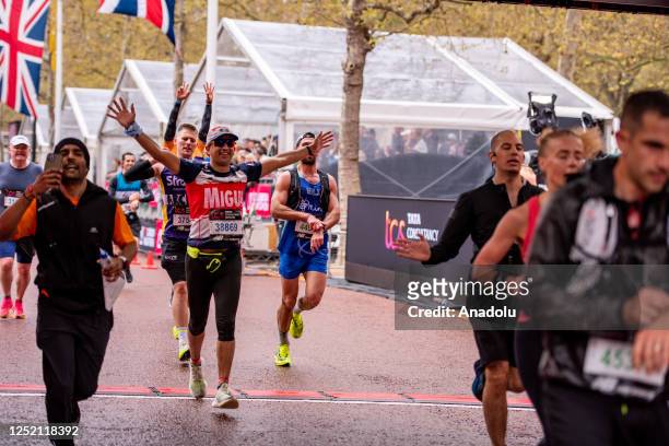 Runners celebrate at the finish line of London Marathon in London, United Kingdom on April 23, 2023.