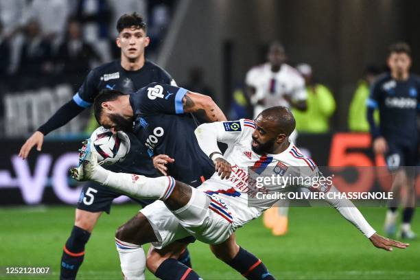 Lyon's French forward Alexandre Lacazette fights for the ball with Marseille's French defender Samuel Gigot during the French L1 football match...