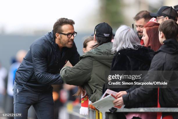 Wrexham co-owner Ryan Reynolds greets fans before the Vanarama National League match between Wrexham and Boreham Wood at Racecourse Ground on April...