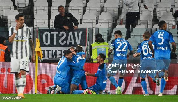 Napoli's Italian forward Giacomo Raspadori celebrates with teammates after scoring his team's first goal during the Italian Serie A football match...